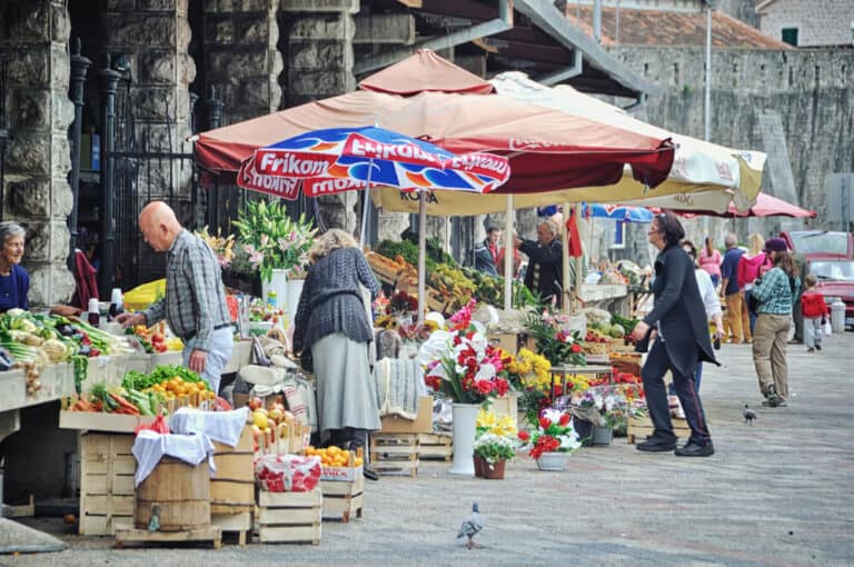 Street market down the fortress wall. The city located on the Bay of Kotor and is one of the most visited touristic sites of the Adriatic Sea