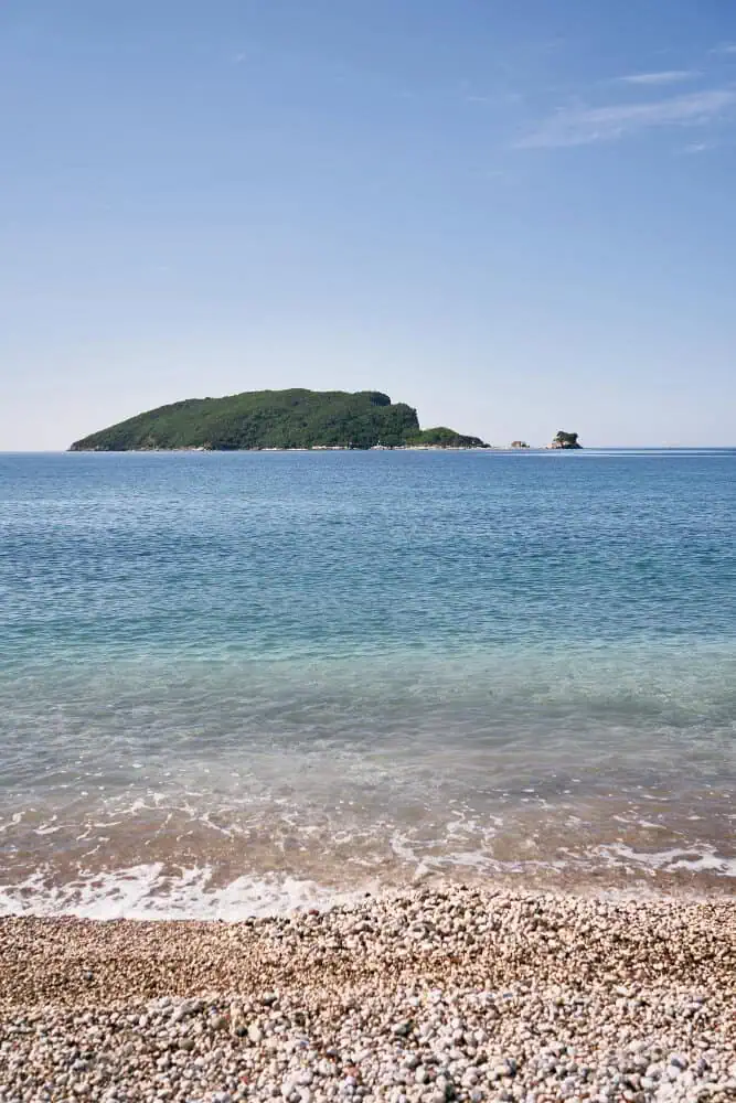 View from the pebble beach to the island of st nicholas budva montenegro